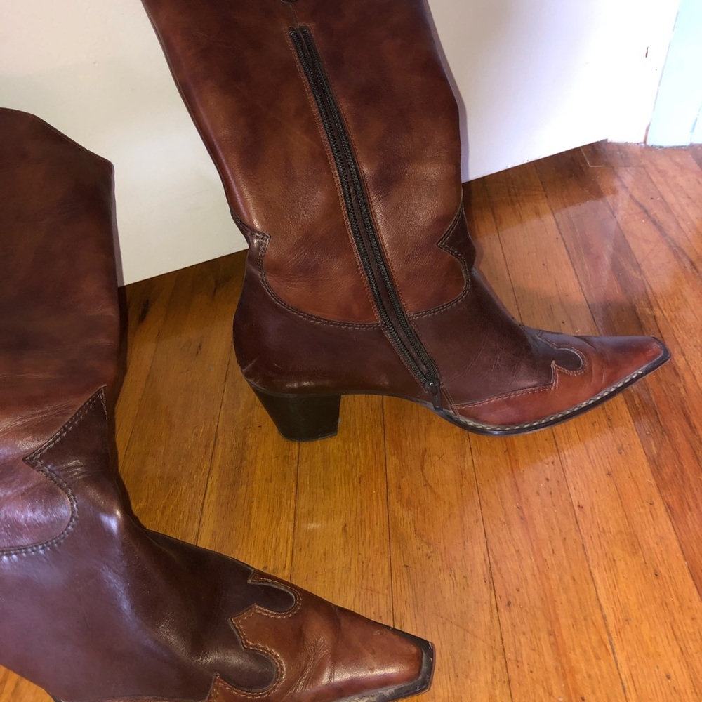 Paul Green knee high brown boots.
